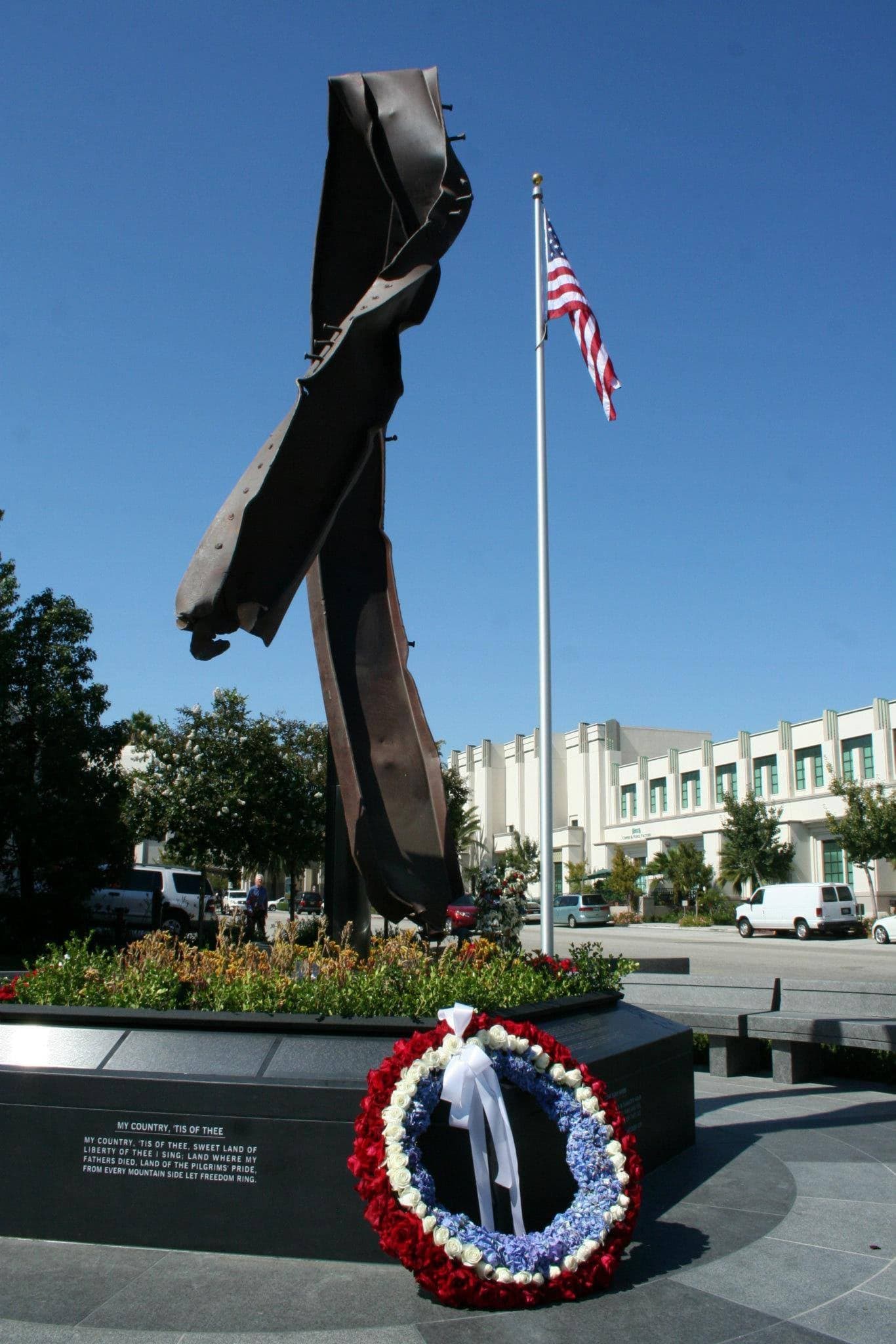 Memorial leadership beside the Beverly Hills 9/11 Memorial Garden steel artifact